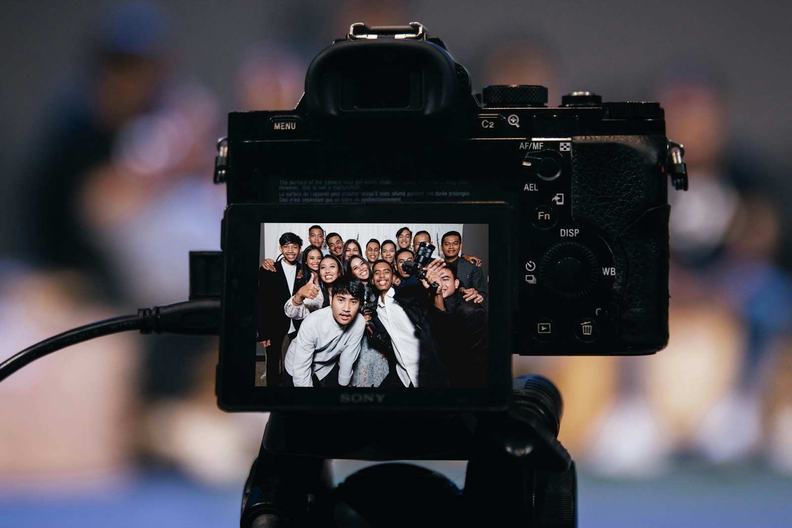 black dslr camera taking picture of 2 women